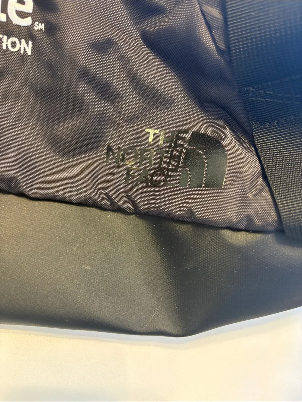 The North Face Black Duffel with Allstate Logo